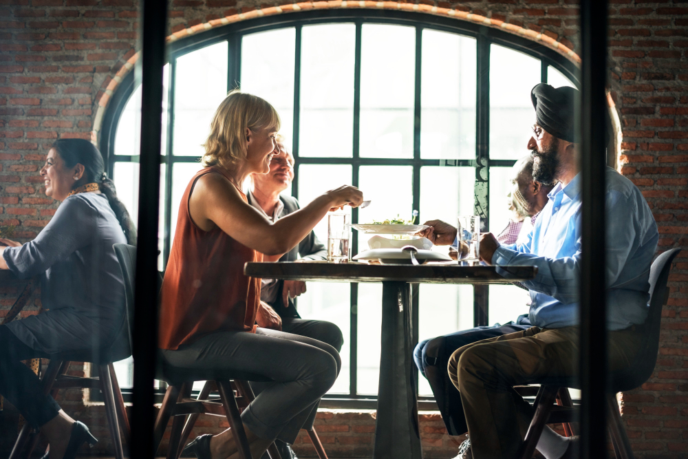 Friends sharing a meal at a restaurant table