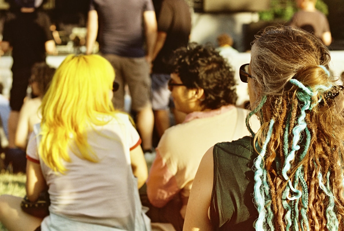 friends sitting together at community event