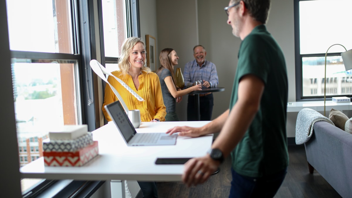 people collaborating around table in modern space