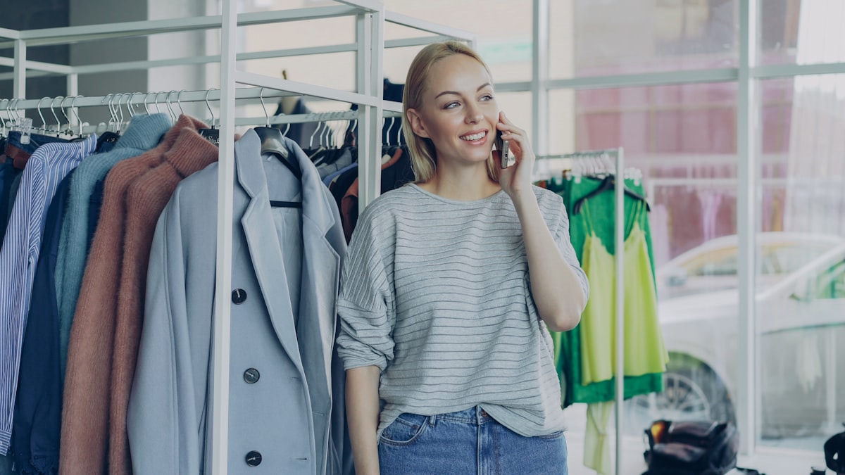 Small business owner on phone in retail store